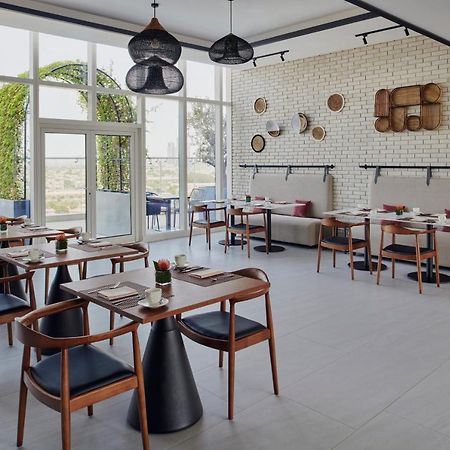 Movenpick Jumeirah Village Triangle Dubai Bagian luar foto Restaurant