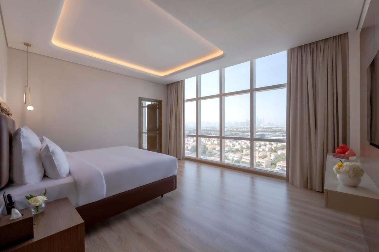 Movenpick Jumeirah Village Triangle Dubai Bagian luar foto Suite bedroom