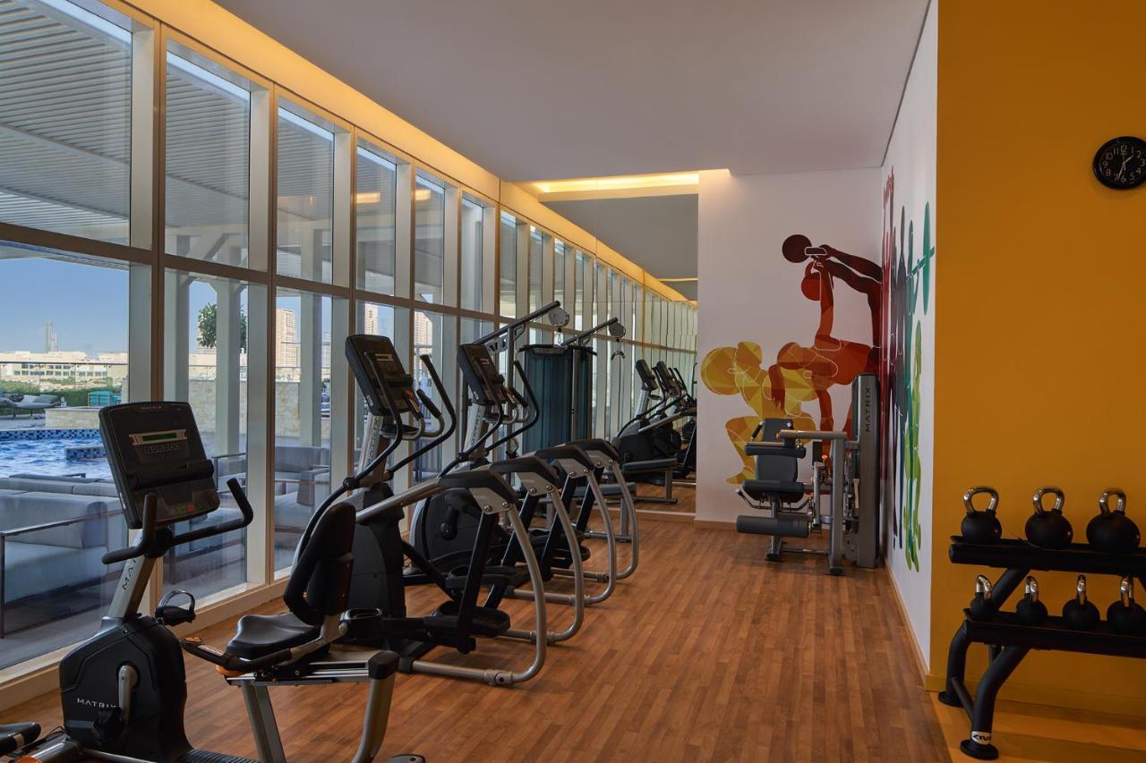 Movenpick Jumeirah Village Triangle Dubai Bagian luar foto The gym at the hotel