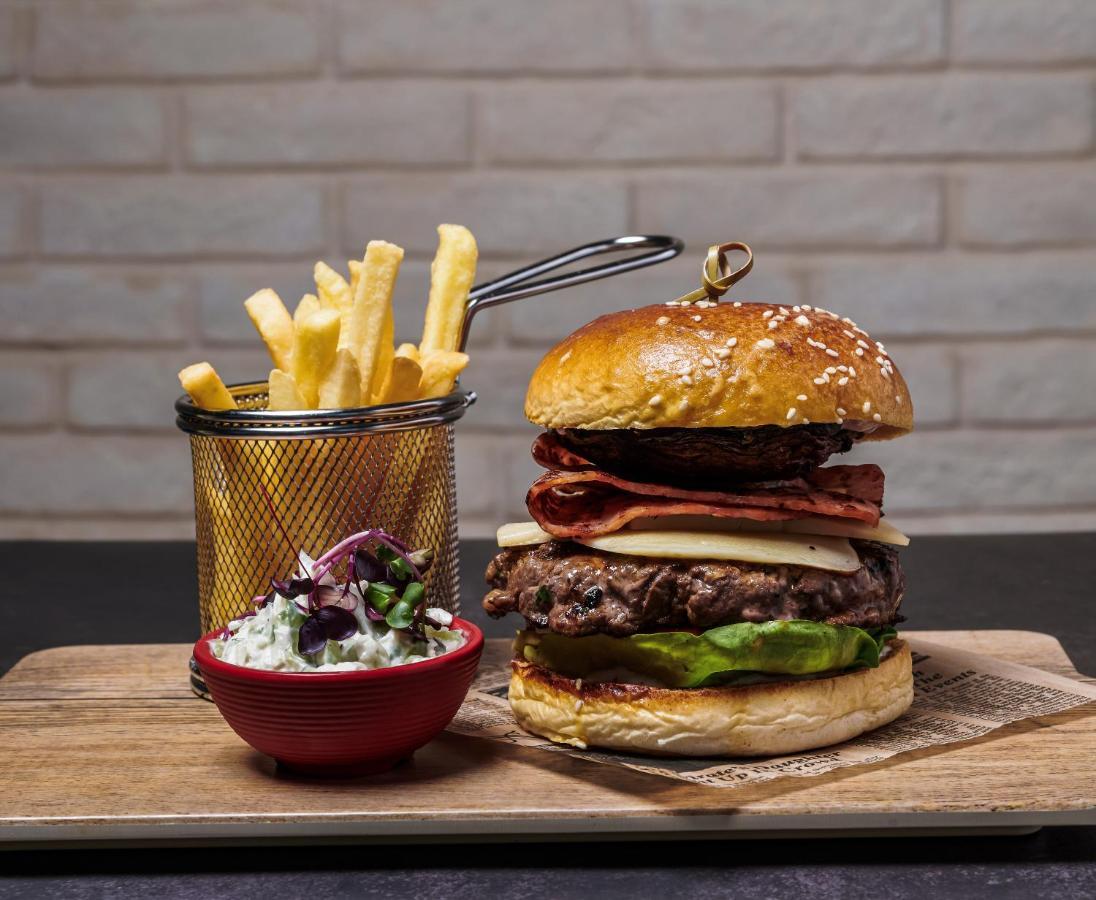 Movenpick Jumeirah Village Triangle Dubai Bagian luar foto A hamburger with chips