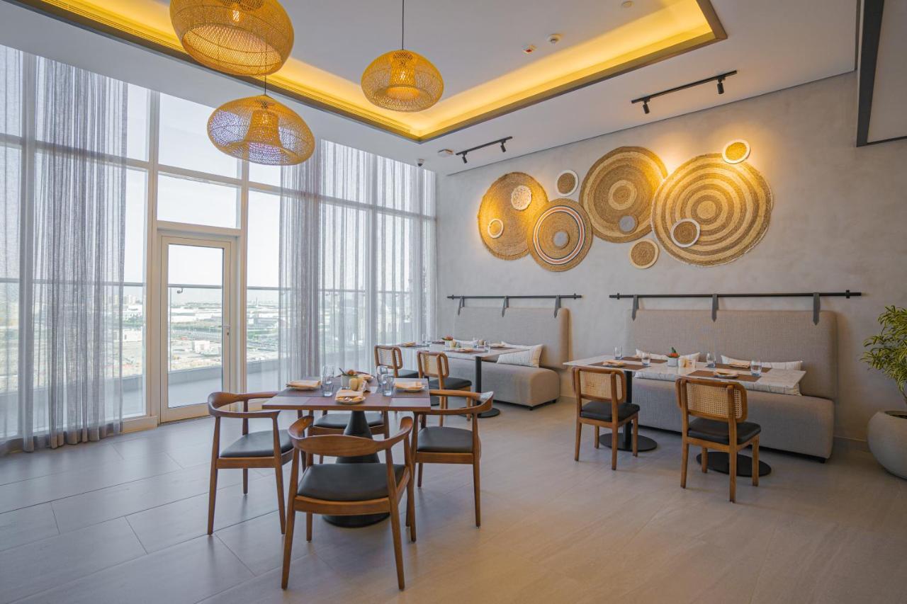 Movenpick Jumeirah Village Triangle Dubai Bagian luar foto The restaurant