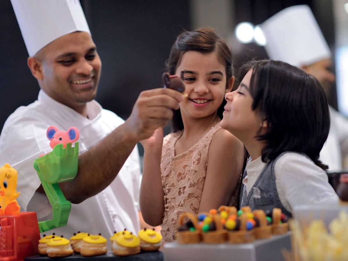 Movenpick Jumeirah Village Triangle Dubai Bagian luar foto A pastry chef at work