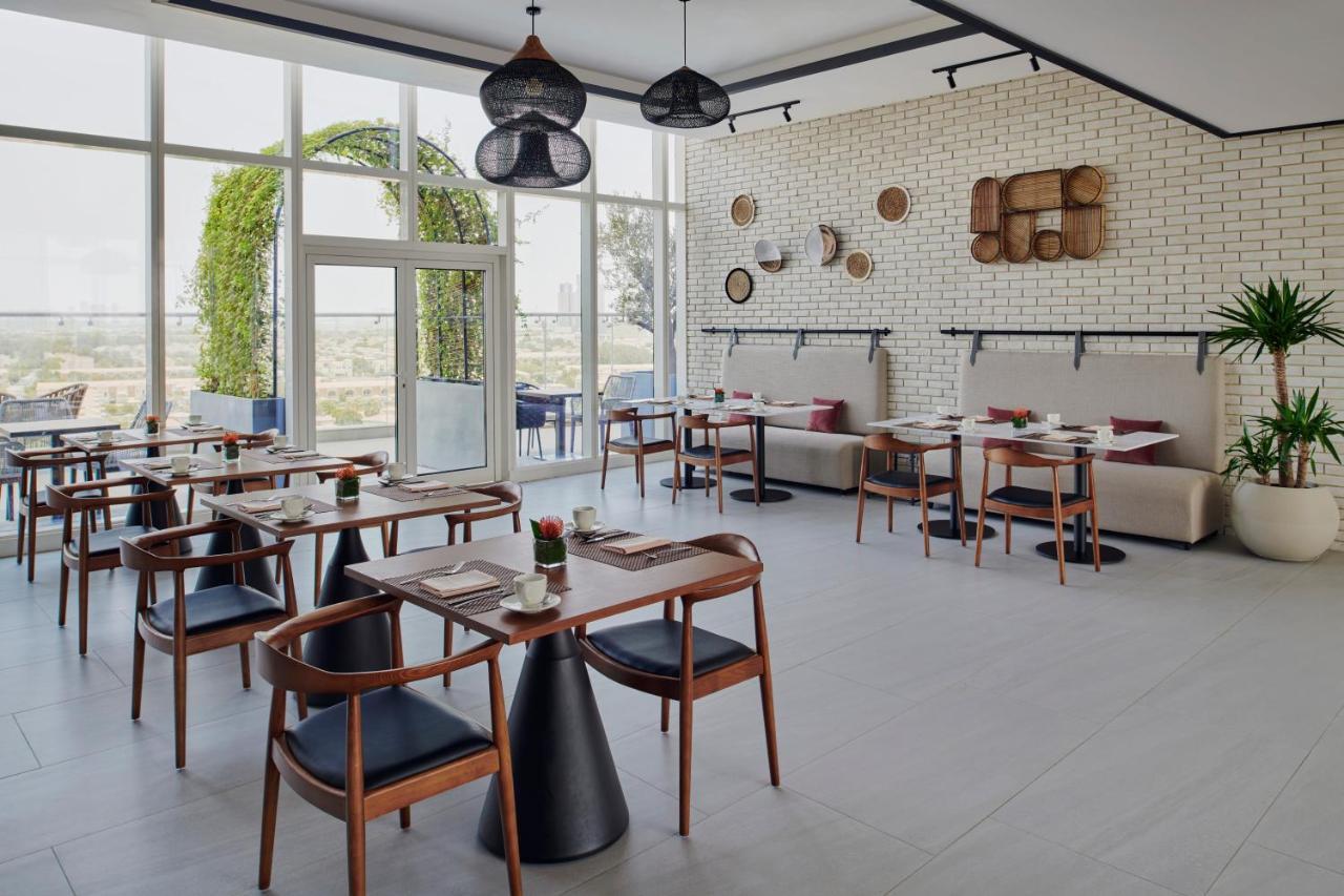 Movenpick Jumeirah Village Triangle Dubai Bagian luar foto Restaurant