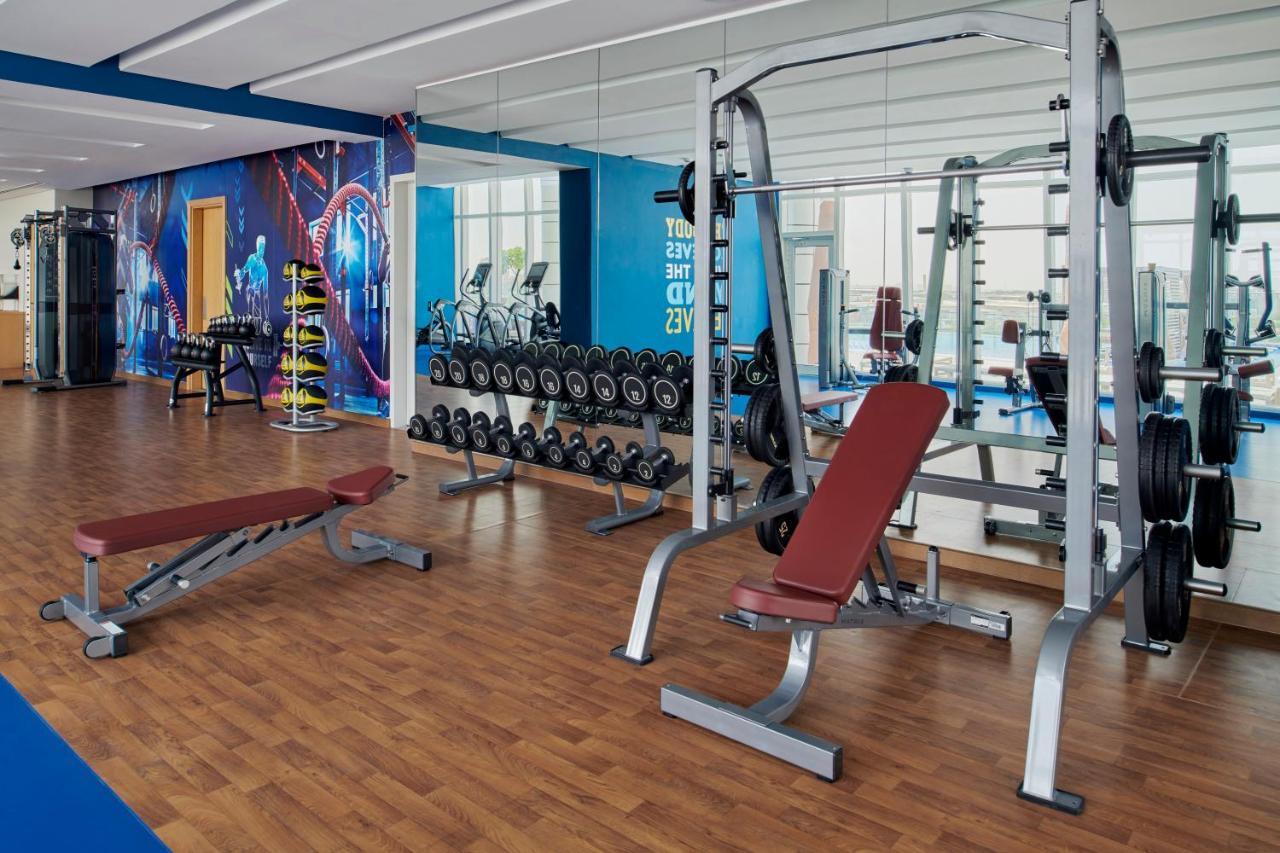 Movenpick Jumeirah Village Triangle Dubai Bagian luar foto A modern gym