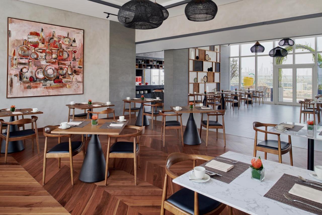 Movenpick Jumeirah Village Triangle Dubai Bagian luar foto The restaurant