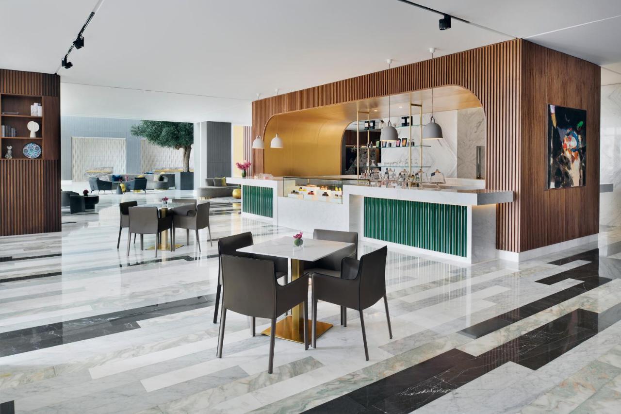 Movenpick Jumeirah Village Triangle Dubai Bagian luar foto Interior of the hotel