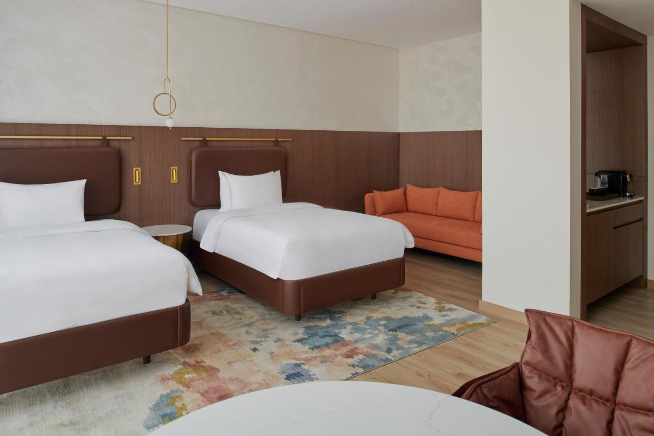 Movenpick Jumeirah Village Triangle Dubai Bagian luar foto A room at the hotel